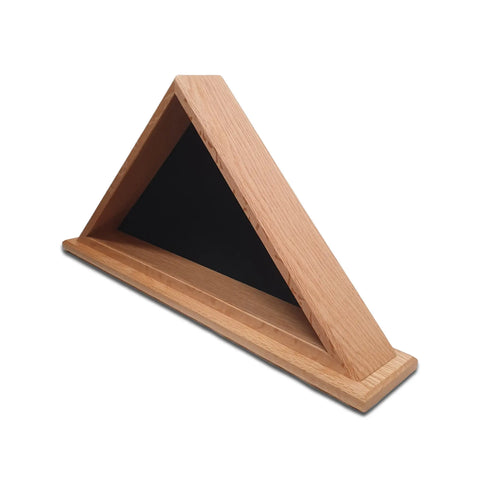 The Legacies of America Woodworking Company Oak Burial Flag Display Case (5 x 9.5 flag) features a triangular oak hardwood frame, black back panel, natural wood finish, and modern lines—ideal for flat surfaces.