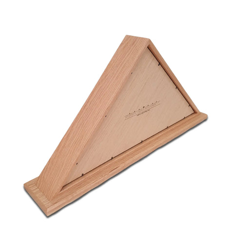 The Legacies of America Woodworking Companys Oak Burial Flag Display Case displays a 5 X 9.5 flag in a triangular oak frame with a smooth finish, metal pins on one side, and a measurement scale printed on the front. Made in the USA.