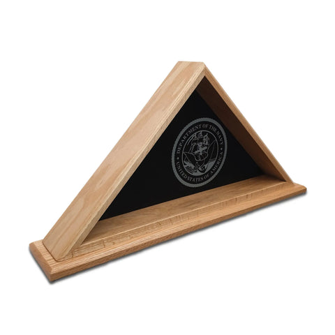 The Oak Burial Flag Display Case (5 x 9.5), by Legacies of America Woodworking Company, features the Department of the Navy seal on black, glass front, and is proudly made in the USA by veterans to hold a folded American flag.