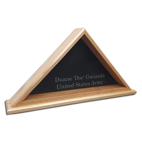 The Oak Burial Flag Display Case (5 X 9.5 Flag) by Legacies of America Woodworking Company features a black background, is engraved with Duane Doc Gwiazda United States Army, and is proudly built by veterans in the USA.