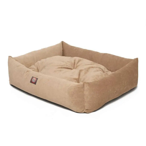 The Majestic Pet Villa Luxe Bagel Bed is a rectangular beige plush dog bed with raised sides and a padded center cushion for comfort. This luxurious, machine washable pet bed is shown on a white background.