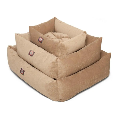 Three tan, rectangular Villa Luxe Bagel Beds by Majestic Pet, each with a side logo patch, are stacked inside one another. The plush beds feature raised sides and a soft texture for luxurious comfort in various sizes.