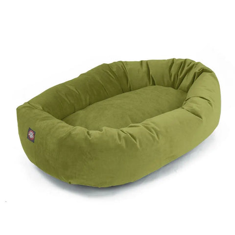 The Majestic Pet Villa Bagel Dog Bed is a green, oval, plush pet bed with raised sides and a cushioned polyester micro-velvet base, shown on a white background.