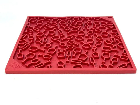 The SodaPup Vino Design EMat Enrichment Lick Mat is a red silicone tray with scattered geometric cavities, perfect for interactive pet feeding. Its flat, rectangular shape makes it easy to use and clean for all pet owners.