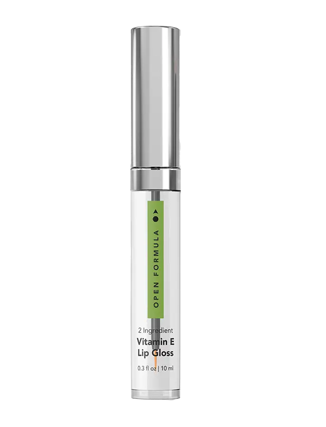 A clear tube of Vitamin E Lip Gloss from Open Formula with a shiny silver cap and green accent, labeled 2 Ingredient Vitamin E & Castor Oil Lip Gloss, 0.3 fl oz | 10 ml.