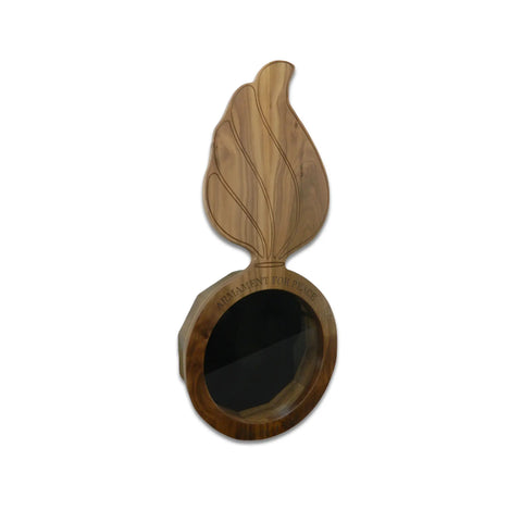 The Walnut Ammo Pisspot Shadow Box by Legacies of America Woodworking Company features real glass, a large decorative leaf design extending upward, and ARMAMENT FOR PEACE engraved on the white upper edge.