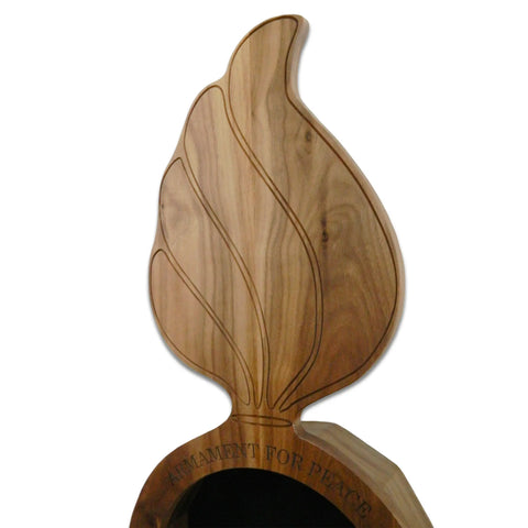 The Walnut Ammo Pisspot Shadow Box by Legacies of America Woodworking Company is a walnut hardwood sculpture with engraved lines and ARMAMENT FOR PEACE at its base, crafted in the USA and set against a plain white background.