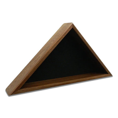 The Walnut Burial Flag Display Case (5 X 9.5 Flag) by Legacies of America Woodworking Company features a triangular wooden design, black interior, and can be wall-mounted or placed on a flat surface. Made in the USA.