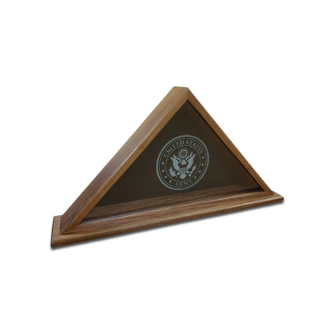 The Legacies of America Woodworking Walnut Burial Flag Display Case (5 X 9.5) is a triangular wood case with a glass front, featuring the U.S. Army emblem. Built by veterans in the USA, its shown empty against a white background.