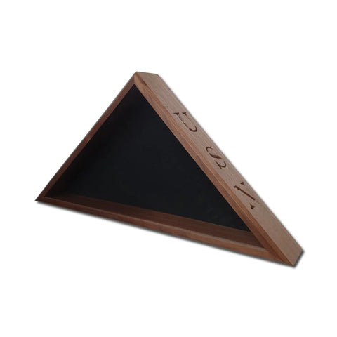 The Navy Veteran USN - Walnut Burial Flag Display Case by Legacies of America Woodworking Company features a handcrafted triangular wooden frame with a black inner surface and engraved numbers, shown on a white background.