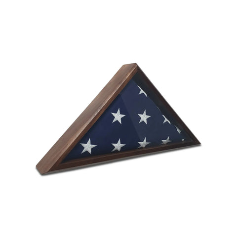 A Walnut 4x6 Flag Display Case by Legacies of America Woodworking Company holds a folded American flag with white stars on blue, shown against a white background.