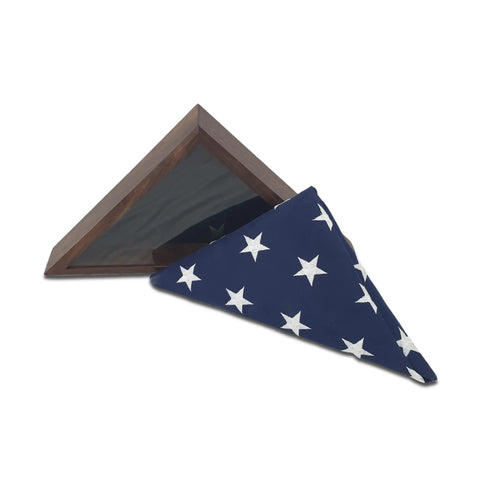 A folded American flag rests in front of an open, empty Walnut 4x6 Flag Display Case by Legacies of America Woodworking Company.