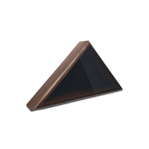 The Legacies of America Woodworking Company Walnut 4x6 Flag Display Case is a modern triangular wooden shelf with a dark interior, perfect for displaying an American flag, shown angled on a white surface.