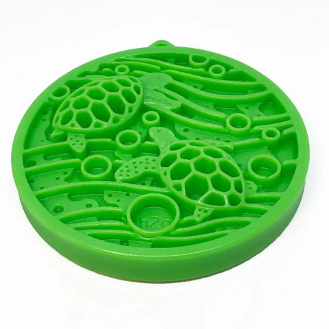 The SodaPup Water Nylon ECoin is a round, green silicone disk featuring two raised sea turtles, waves, and bubbles with h2o embossed. Perfect for enrichment snacks or to help pets with problem chewing.