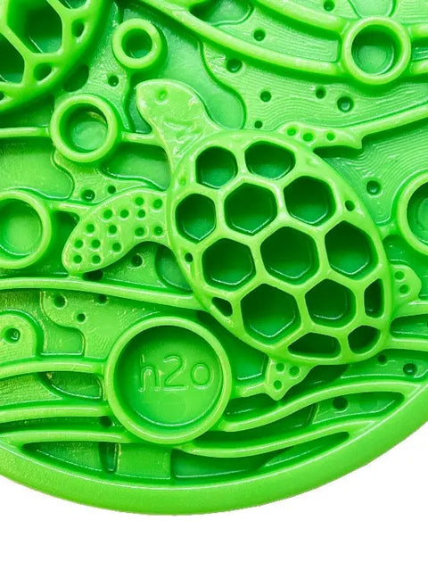The SodaPup Water Nylon ECoin Durable Enrichment Snacking Coin is a bright green coin with a sea turtle design, wavy lines, and h2o text—ideal for holding treats or peanut butter to support dogs with problem chewing.