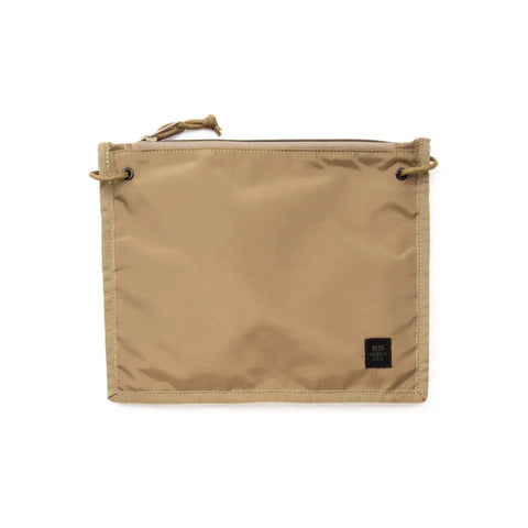The MIS 2 Way Pouch - Coyote Tan is a rectangular, water-resistant clutch with cords through metal eyelets and a small black label in the bottom right corner for added protection.