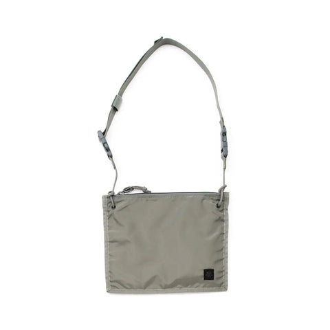 The MIS 2 Way Pouch - Foliage is a minimalist rectangular gray shoulder bag made in the USA from durable packcloth nylon, with an adjustable strap, zipper closure, and a small black logo tag at the bottom right, shown on a white background.