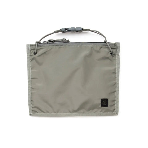 The MIS 2 Way Pouch - Foliage is a rectangular gray zippered pouch made of durable packcloth nylon, with a small black label at the bottom right and an adjustable cord handle featuring a clasp at the top.
