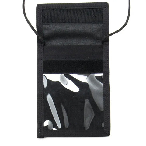The MIS ID Passport Case - Black is a water-resistant Cordura nylon neck wallet with a transparent front window, visible interior compartments, and side black straps—ideal for securely carrying your passport while traveling.