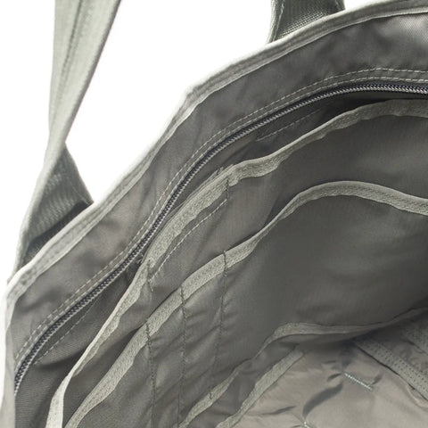 Close-up of the interior of the MIS Tote Bag - Foliage in gray Cordura Nylon, highlighting multiple compartments, pockets, a heavy-duty zipper, and visible stitching for organized storage.