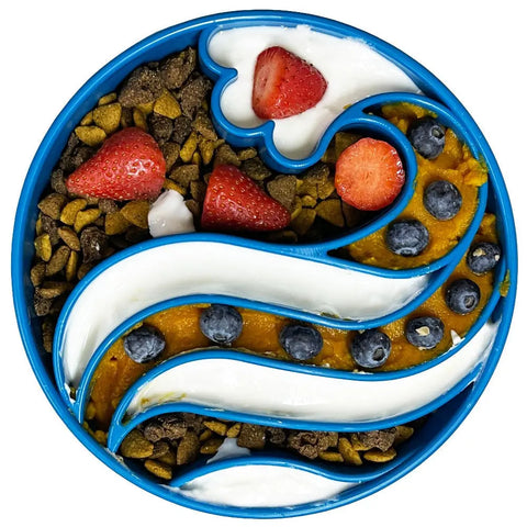 The SodaPup Wave Design EBowl Enrichment Slow Feeder Bowl for Dogs, filled with kibble, strawberries, blueberries, white yogurt, and orange puree in a swirl pattern, encourages healthier and slower eating for your pet.