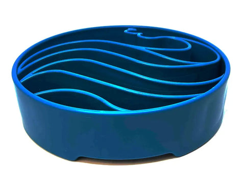 The SodaPup Wave Design EBowl Enrichment Slow Feeder Bowl for Dogs features a round, blue plastic design with raised wavy ridges to encourage slower, healthier eating for your pet.