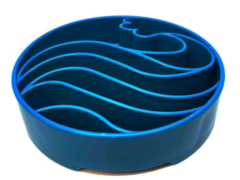 The SodaPup Wave Design EBowl Enrichment Slow Feeder Bowl for Dogs is a round, blue bowl with raised wavy barriers inside to promote slower, healthier eating for your pet.