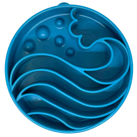 The SodaPup Wave Pattern Enrichment Slow Feeder Dog Bowl, made in the USA, is a round blue bowl with wavy ridges and raised bumps inside to help dogs eat more slowly and enjoy interactive mealtime.
