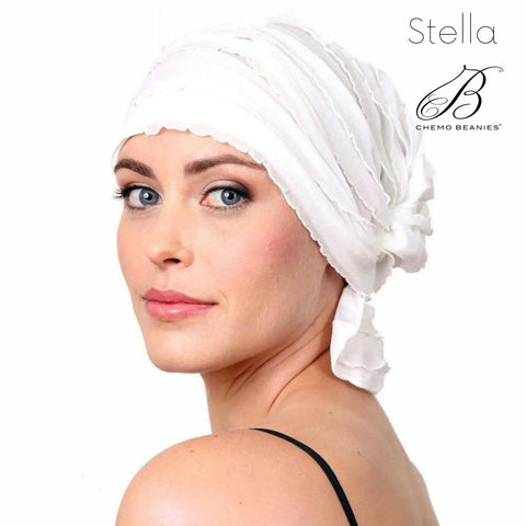 A woman wears the Stella Chemo Beanies® slip-on beanie and looks over her shoulder with a soft expression. The Chemo Beanies® brand name appears in the top right corner.