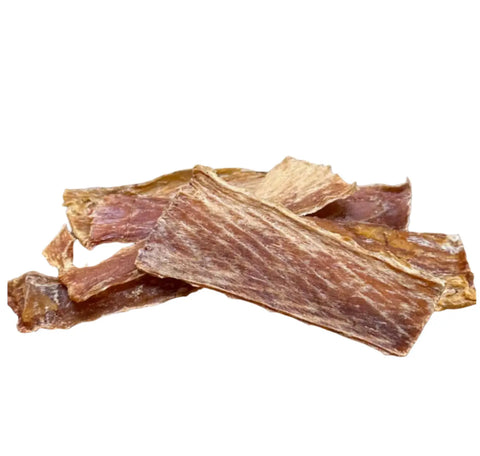 Dogtown Bakery’s Ono Ono Bark features several pieces of dried, brownish fish jerky stacked on a white background, making delicious, wholesome treats for dogs.