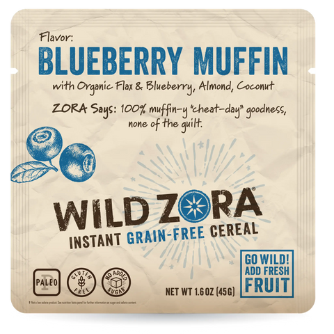 Front of a Wild Zora Instant Cereal - Blueberry Muffin With Blueberry, Almond & Coconut 10-Pack package. Shows blueberries, highlights “organic flaxseed, almond, coconut,” “Go Wild! Add Fresh Fruit,” and notes no added sugar.