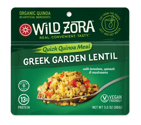 A green pouch of Wild Zora Quinoa Meals – Greek Garden Lentil, featuring quinoa, lentils, tomatoes, spinach, and mushrooms with Mediterranean spices. This vegan meal is gluten free and offers 13g of protein per serving.