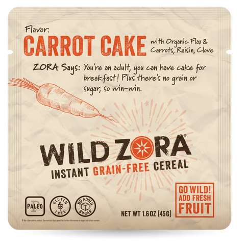 Front of a Wild Zora Instant Cereal - Carrot Cake With Carrots, Raisin & Clove 10-Pack box, showing a carrot illustration and calling out organic flaxseed, no added sugar, paleo-friendly ingredients, and fruit included.