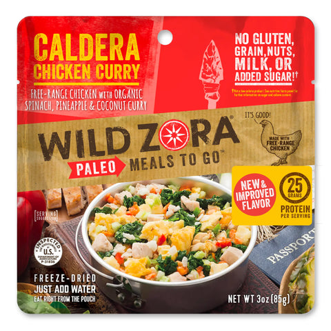 A colorful pouch of Wild Zora Meals to Go - Caldera Chicken Curry, showing the meal with free-range chicken, spinach, pineapple, and coconut. Packaging notes no gluten, grains, nuts, milk, or added sugar.