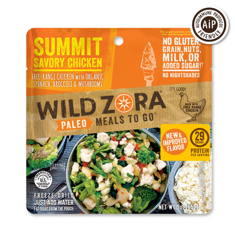 Wild Zora Meals to Go - Summit Savory Chicken features freeze-dried, free-range chicken with veggies, 29g protein, and no gluten, grain, nuts, milk, or added sugar—shown as a bowl of chicken and vegetables on the label.