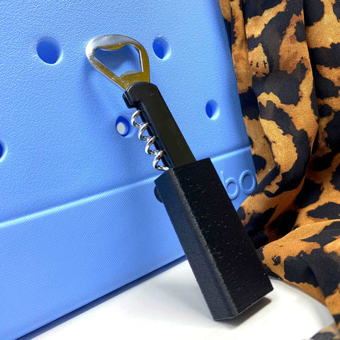 The Chatelet Manufacturing BOGLETS Wine & Bottle Opener Charm Accessory is compatible with Bogg Bags, adding style and convenience—perfect for keeping a wine opener handy on your tote with chic black and brown spotted flair.