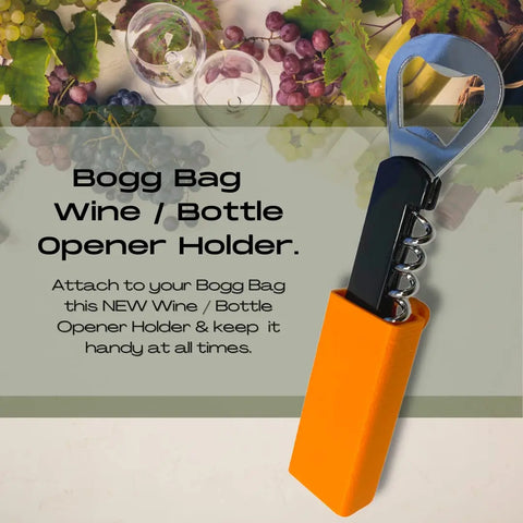 The Chatelet Manufacturing BOGLETS Wine & Bottle Opener Charm, a black-handled opener with orange holder, attaches easily to Bogg Bags for on-the-go convenience. Shown among grapes, leaves, and wine glasses for stylish appeal.