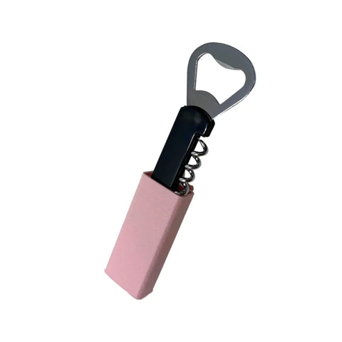 The Chatelet Manufacturing BOGLETS Wine & Bottle Opener Charm is a metal tool with a pink handle, designed as an accessory for Bogg Bags to keep a wine opener handy with your tote, shown against a white background.