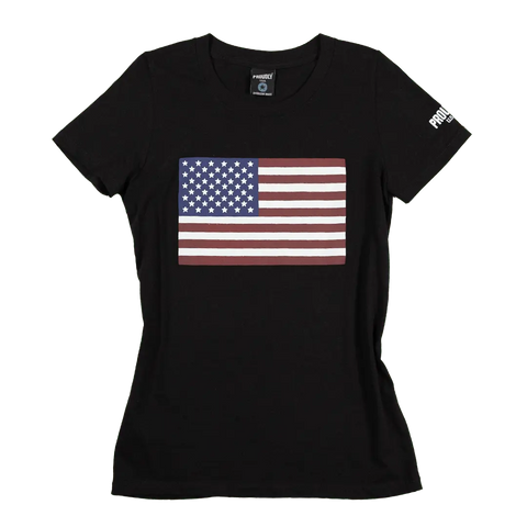 The Proudly USA American Flag - Women’s Cotton T-Shirt (Black) features a large patriotic flag graphic on the front and a small white logo on the left sleeve.