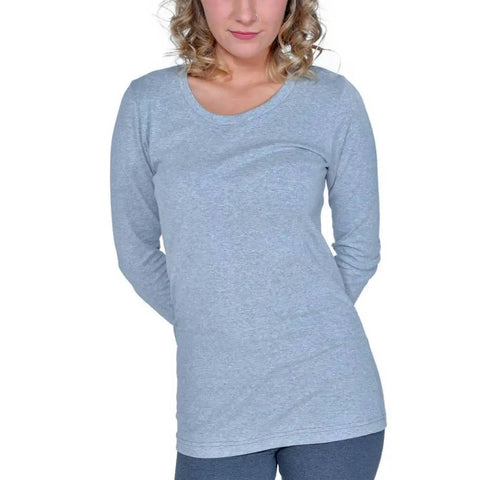 A person with curly blonde hair wears the Spiritex | Sustainable Apparel Long Sleeve Perfect Crewneck Tee (W) and matching gray pants, standing with hands behind their back against a white background.