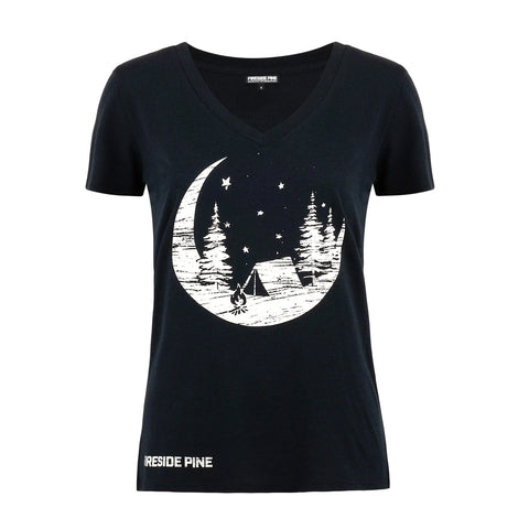 The Oregon Ash - Patriotic Blue by Fireside Pine is a soft Organic Cotton V-neck T-shirt in black, featuring a white graphic of a crescent moon, pine trees, a tent, stars, and RESIDE PINE near the bottom hem.