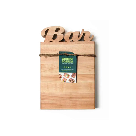 The Wooden Cutting Board – Bar Board by Words with Boards is handcrafted in the USA with Bar cut out at the top, a brown string, and a green tag—perfect for serving cocktails or as a stylish mini cutting board.