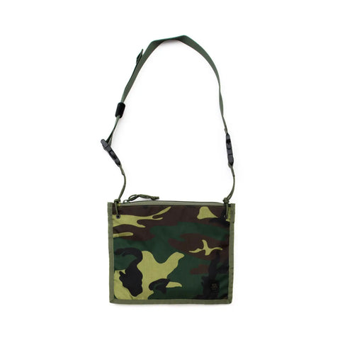 The MIS 2 Way Pouch - Woodland Camo is a rectangular nylon bag with an adjustable strap and zipper closure, water-resistant and ideal for daily use, shown against a white background.