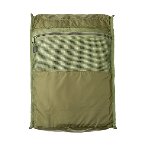 A rectangular Woodland Camo MIS backpack made from Cordura Nylon, featuring a mesh zippered front pocket. Made in USA, it is shown lying flat with the zipper closed.