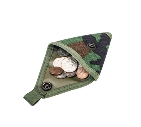 The MIS Coin Case - Woodland Camo, made from Dupont Cordura Nylon with a snap closure, is open to reveal assorted coins inside against a white background.
