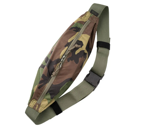 The MIS Body Bag - Woodland Camo is a water-resistant packcloth nylon waist bag with an olive green adjustable strap, black buckle, and secure top zipper closure. Shown on a white background. Made in the USA.