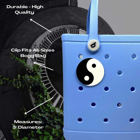 A BOGLETS Yin and Yang Charm by Chatelet Manufacturing, compatible with Bogg Bags, Simply Southern, and other tote bags, styled to add a yin yang touch to your bag.