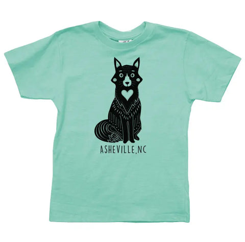 The Asheville Heart Fox Graphic Tee by Spiritex | Sustainable Apparel is a light teal organic cotton youth shirt with a black stylized fox with a heart on its chest and ASHEVILLE, NC below.