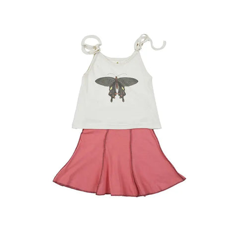 The Spiritex Youth Graphic Butterfly Crop Tie Tank, a sleeveless white top made from 100% organic cotton for sensitive skin, features shoulder ties and a bold butterfly graphic. Shown with a pink flared skirt on a white background.