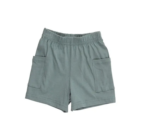 Spiritex | Sustainable Apparel Youth Jersey Shorts in light green, crafted from organic cotton with an elastic waistband and large front pockets, are displayed on a plain white background. Made in the USA.